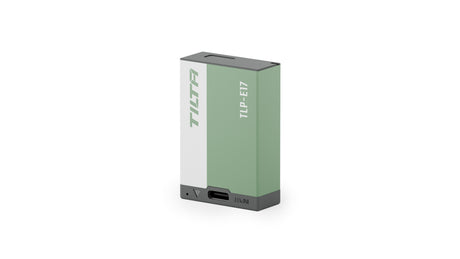 Tilta TLP-E17 950mAh camera battery in Ash Green, three-quarter view showing the USB-C input port on the front edge